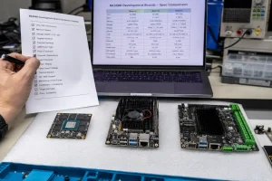 Engineer comparing multiple RK3588 development boards with specification checklist on workbench